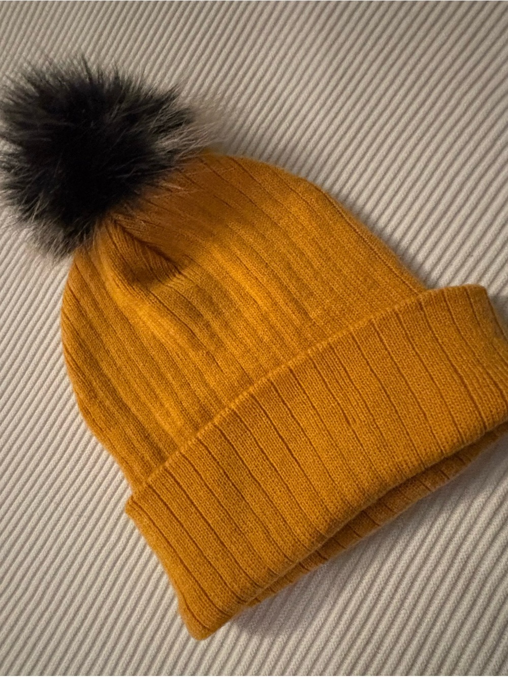 Cozy Mustard Ribbed Beanie with Black Faux-Fur Pom